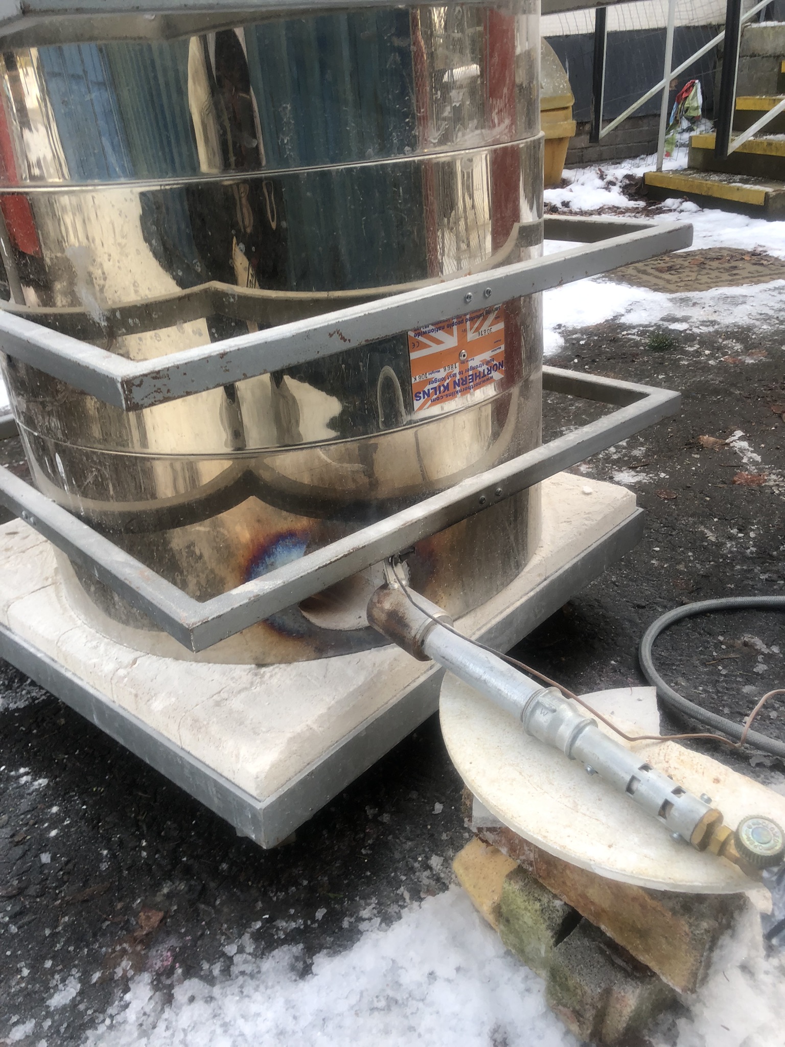 Raku kiln in use during reduction firing — Graduate in Residence workshop