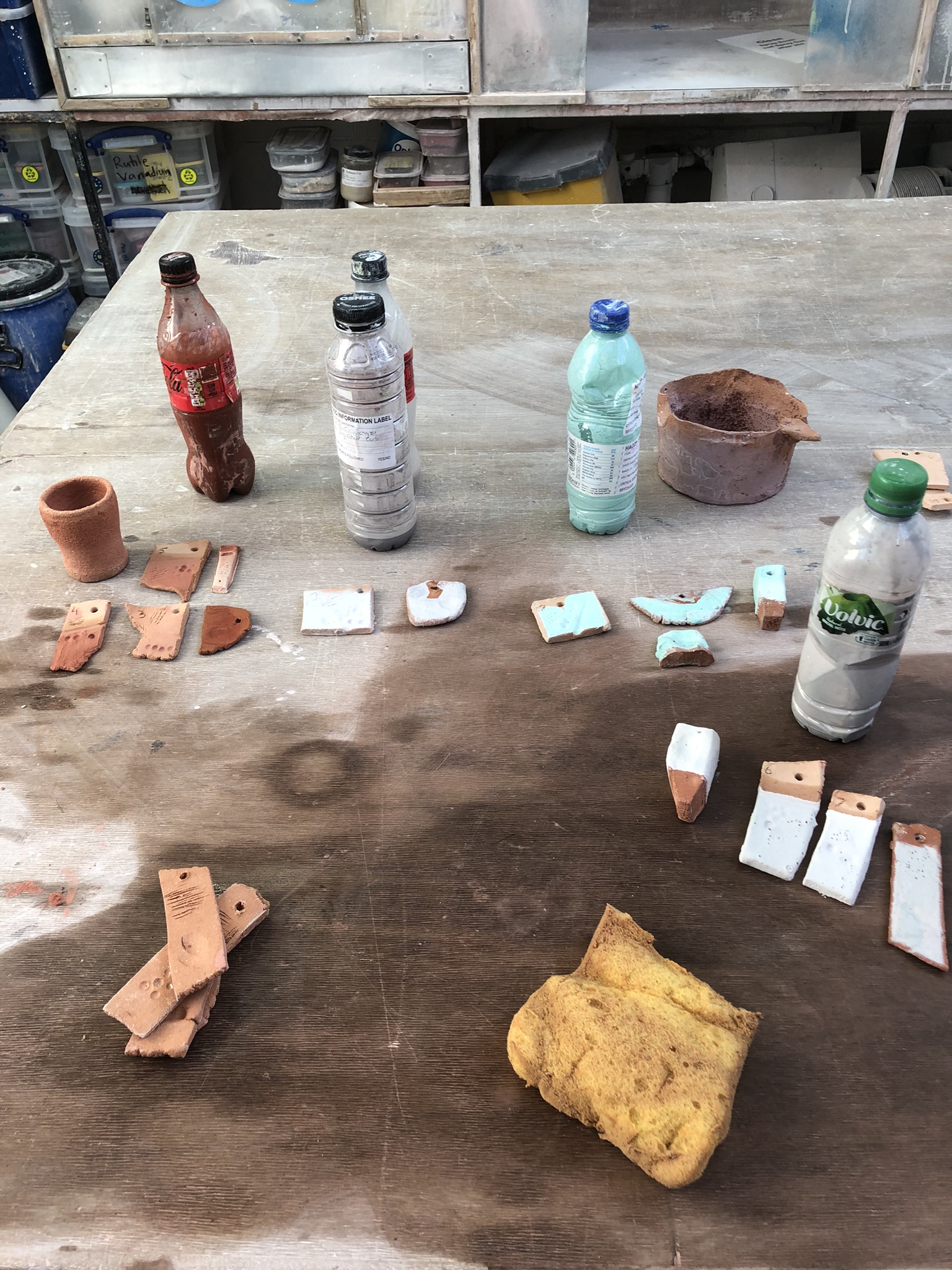 Workshop glaze testing — test tiles laid out for cone 6 and cone 9 firing schedules